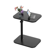 Jules — table basse en C, hauteur réglable près du canapé